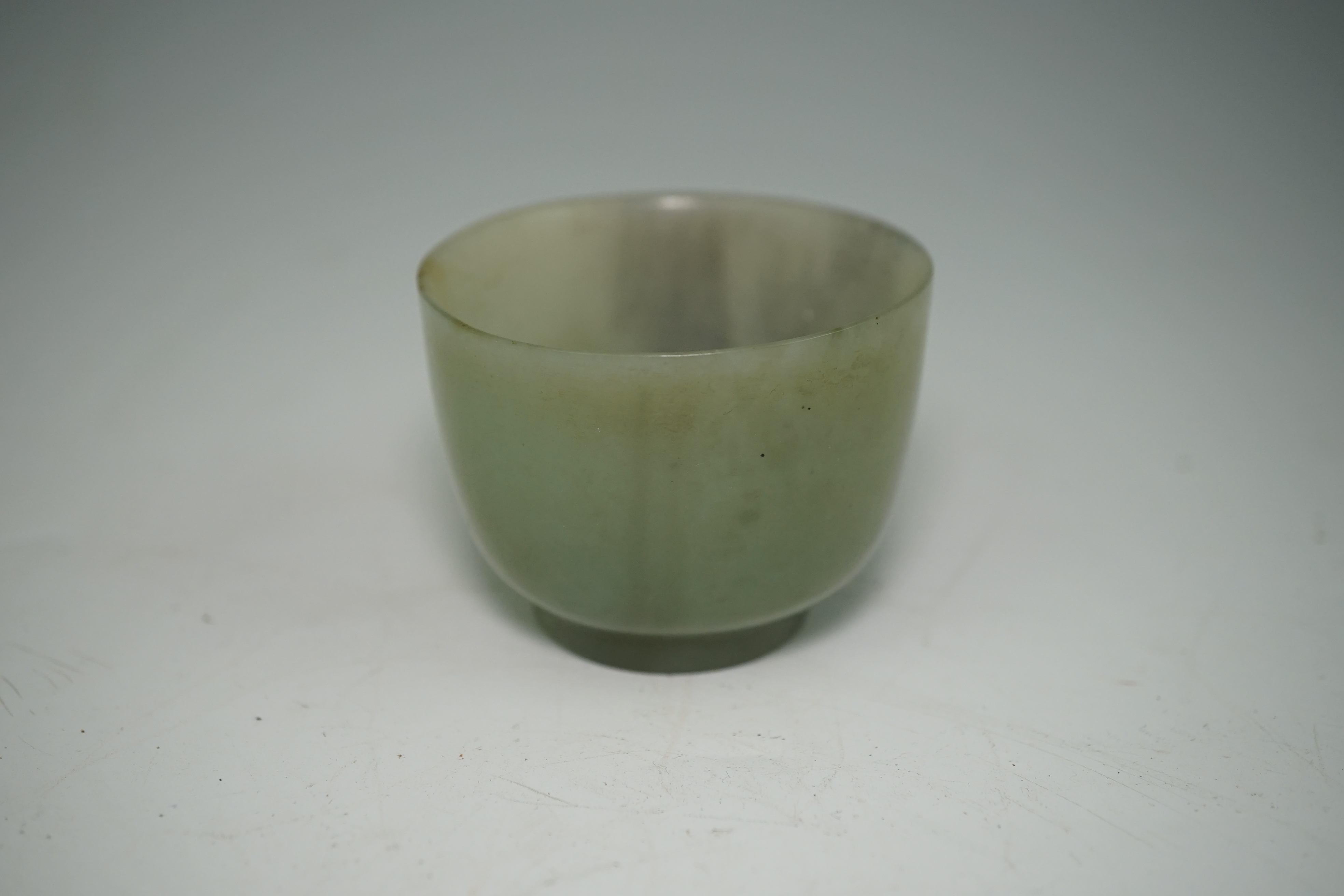 A Chinese pale celadon jade cup, 18th / 19th century